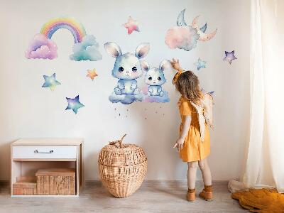 Autocolant pentru perete 80x107 Iepurași într-un cer pastel cu un curcubeu și stele