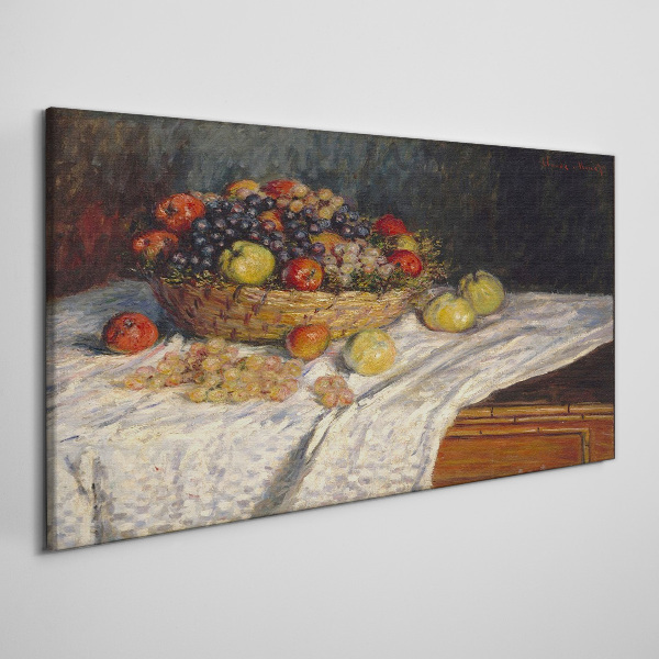 Tablou canvas Coș cu fructe pe o față de masă albă