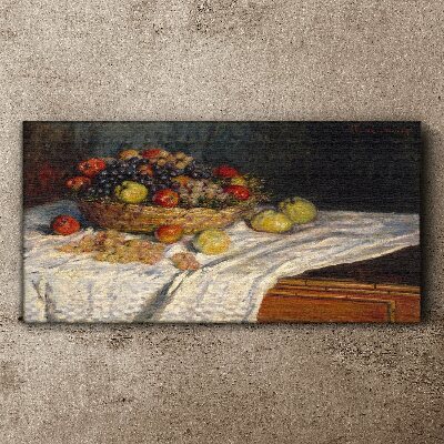 Tablou canvas Coș cu fructe pe o față de masă albă