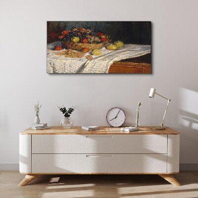 Tablou canvas Coș cu fructe pe o față de masă albă
