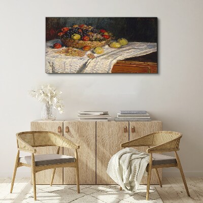Tablou canvas Coș cu fructe pe o față de masă albă
