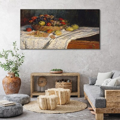 Tablou canvas Coș cu fructe pe o față de masă albă