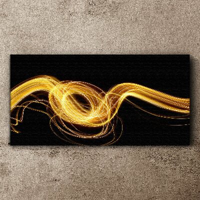 Tablou canvas Dâre aurii de lumină pe negru