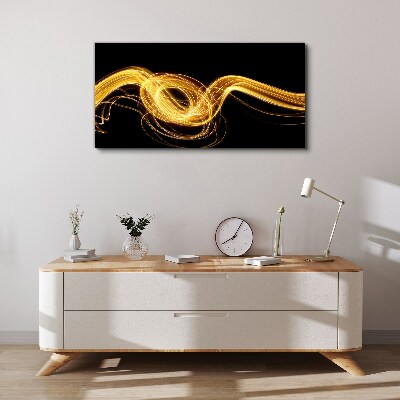 Tablou canvas Dâre aurii de lumină pe negru