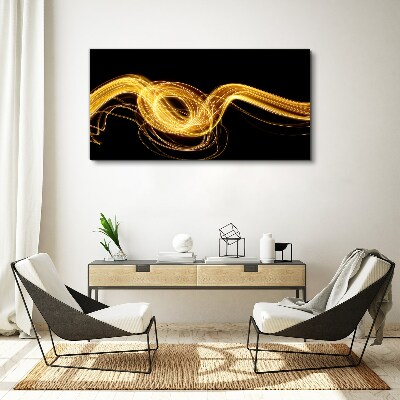 Tablou canvas Dâre aurii de lumină pe negru
