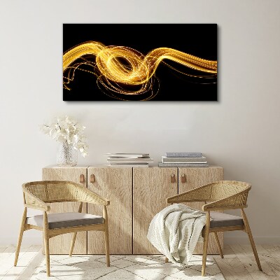 Tablou canvas Dâre aurii de lumină pe negru