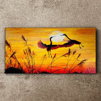 Tablou canvas Macarale dansând la apus