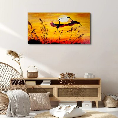 Tablou canvas Macarale dansând la apus