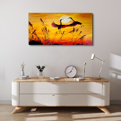 Tablou canvas Macarale dansând la apus