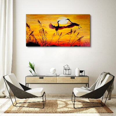 Tablou canvas Macarale dansând la apus