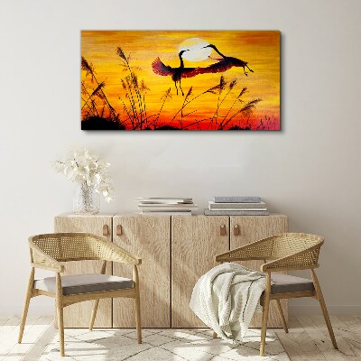 Tablou canvas Macarale dansând la apus