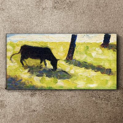 Tablou canvas O vacă care pășește într-un peisaj verde