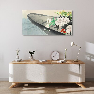 Tablou canvas Barcă cu flori pe apă calmă