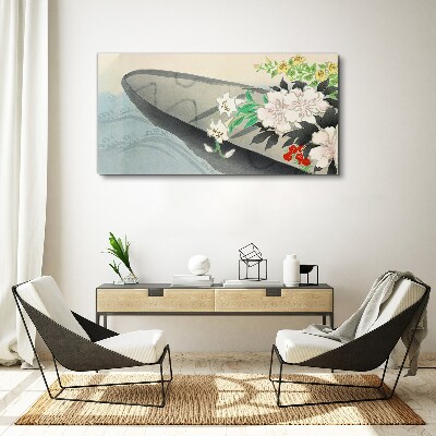 Tablou canvas Barcă cu flori pe apă calmă