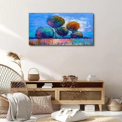 Tablou canvas Copaci colorați pe un fundal albastru