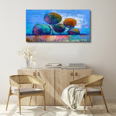 Tablou canvas Copaci colorați pe un fundal albastru