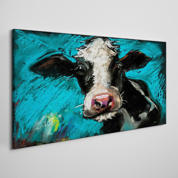 Tablou canvas Portretul unei vaci pe un fundal albastru