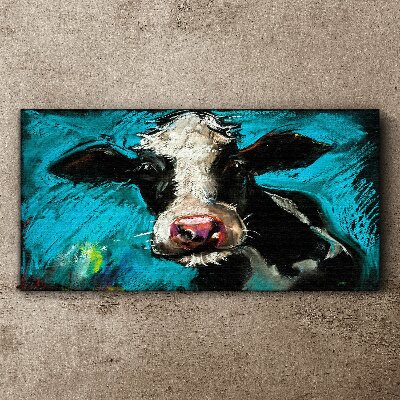 Tablou canvas Portretul unei vaci pe un fundal albastru