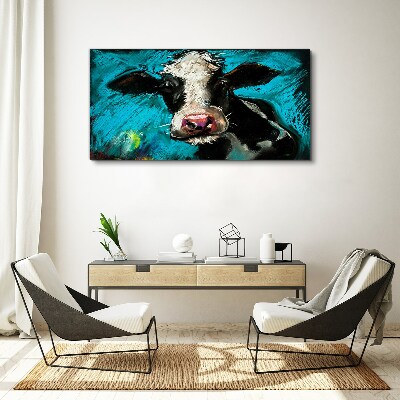 Tablou canvas Portretul unei vaci pe un fundal albastru