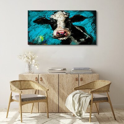 Tablou canvas Portretul unei vaci pe un fundal albastru