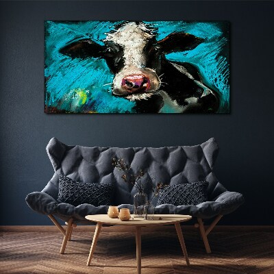 Tablou canvas Portretul unei vaci pe un fundal albastru