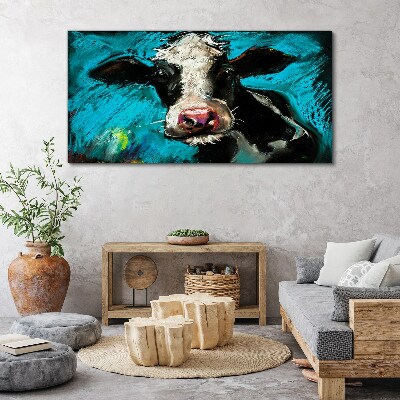 Tablou canvas Portretul unei vaci pe un fundal albastru