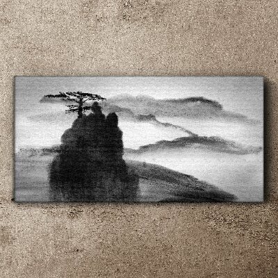 Tablou canvas Un copac singuratic pe un munte stâncos