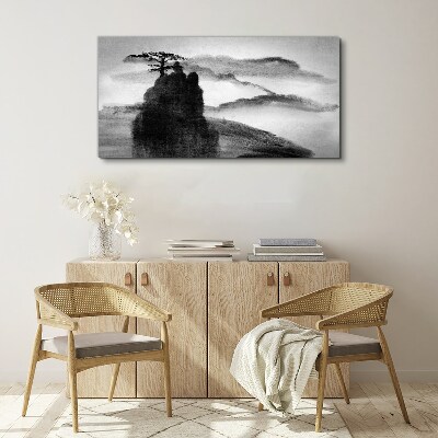 Tablou canvas Un copac singuratic pe un munte stâncos
