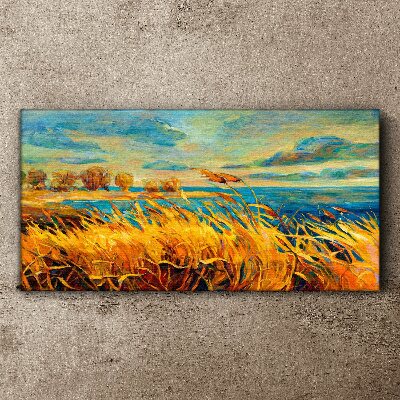 Tablou canvas Iarbă aurie peste apă albastră