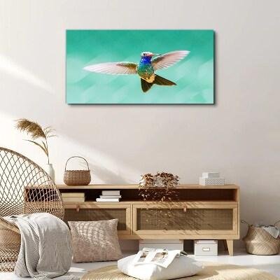 Tablou canvas Pasăre colibri pe fundal albastru