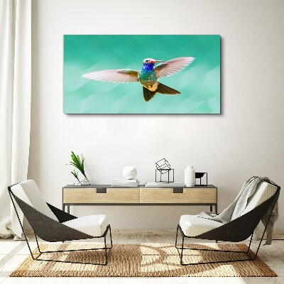 Tablou canvas Pasăre colibri pe fundal albastru