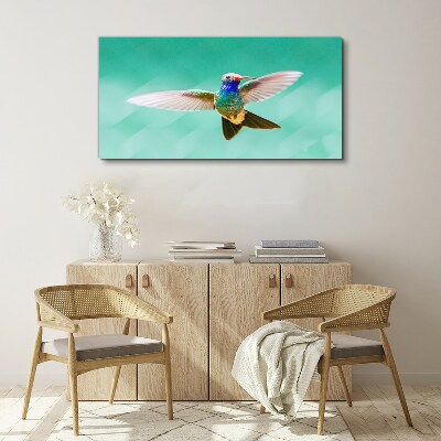 Tablou canvas Pasăre colibri pe fundal albastru