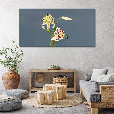 Tablou canvas Flori pe fond albastru