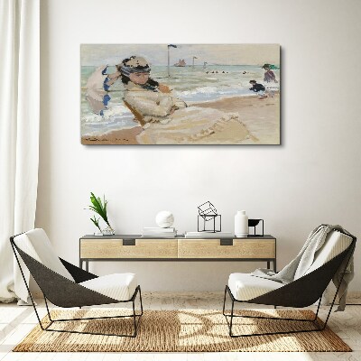 Tablou canvas Femeie pe plajă cu o umbrelă
