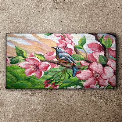 Tablou canvas O pasăre pe un fundal de flori de primăvară