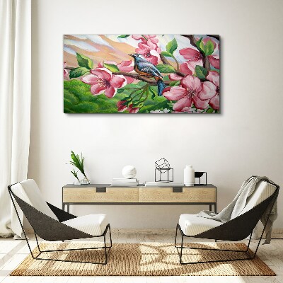 Tablou canvas O pasăre pe un fundal de flori de primăvară