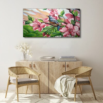 Tablou canvas O pasăre pe un fundal de flori de primăvară