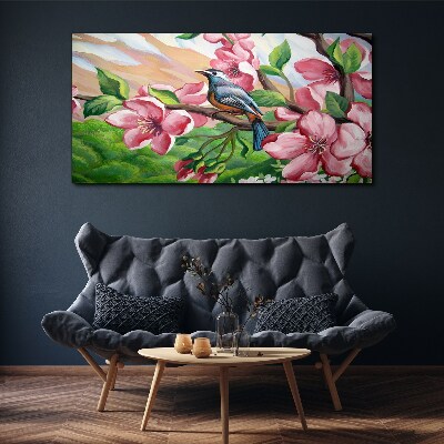 Tablou canvas O pasăre pe un fundal de flori de primăvară