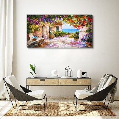 Tablou canvas Aleea cu flori a unui sat de pe litoral