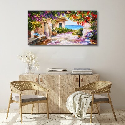 Tablou canvas Aleea cu flori a unui sat de pe litoral