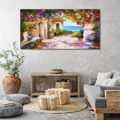 Tablou canvas Aleea cu flori a unui sat de pe litoral