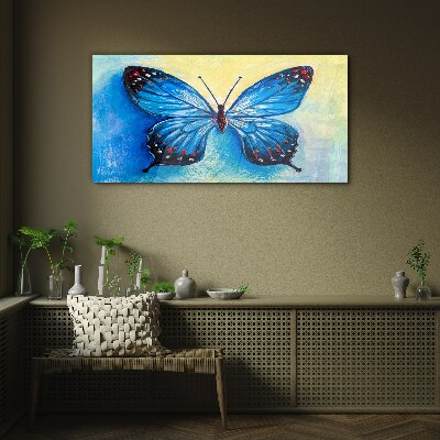 Tablou sticla Fluture albastru pe fundal abstract
