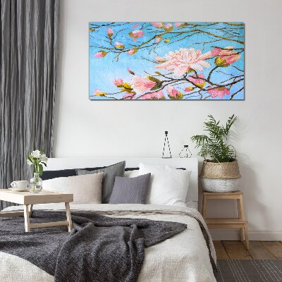 Tablou sticla Flori de magnolie pe fond albastru