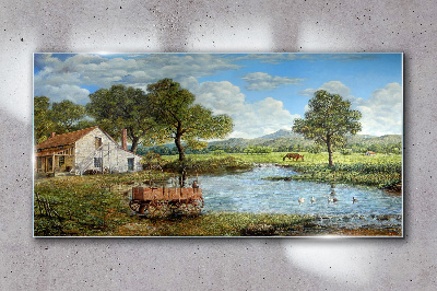 Tablou sticla Un peisaj rural liniștit cu un râu