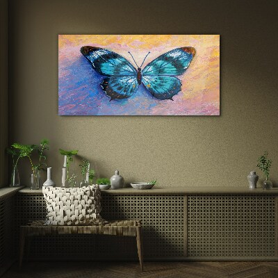 Tablou sticla Fluture albastru pe fundal pastel