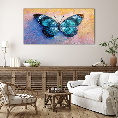 Tablou sticla Fluture albastru pe fundal pastel