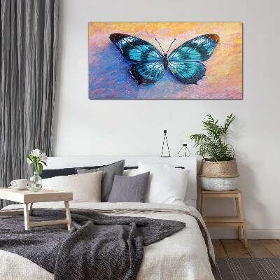 Tablou sticla Fluture albastru pe fundal pastel