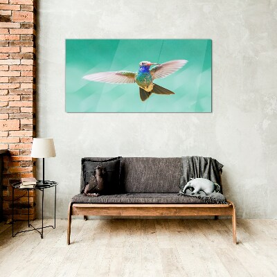 Tablou sticla Pasăre colibri pe fundal albastru