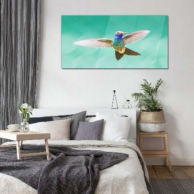 Tablou sticla Pasăre colibri pe fundal albastru